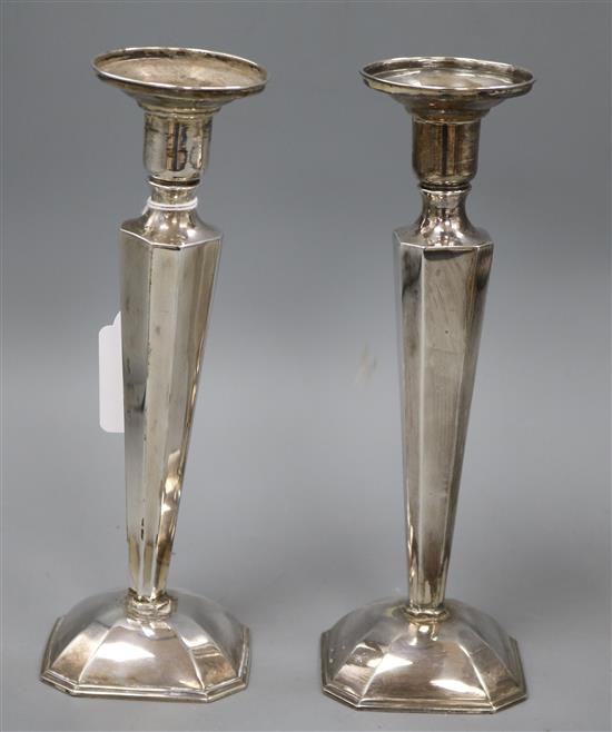 A pair of Chinese white metal candlesticks (a.f.), 22.5cm.